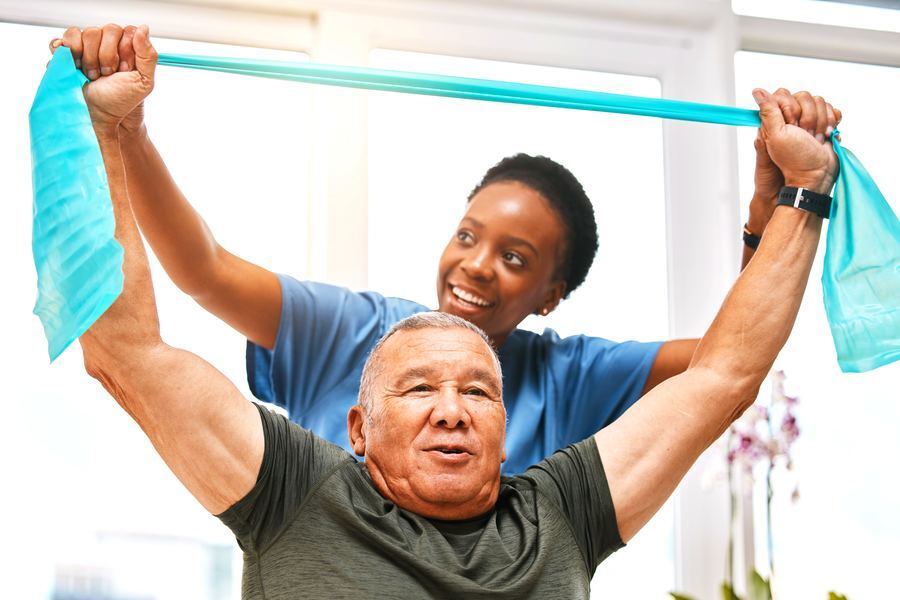 A clinician progressing a patient through resisted shoulder work